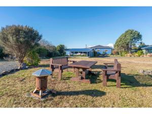 a picnic table and a fire hydrant in a park at Adventure Seekers Lodge - National Park Retreat in National Park