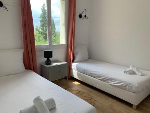 Ένα ή περισσότερα κρεβάτια σε δωμάτιο στο Appartement familial avec parking privatif