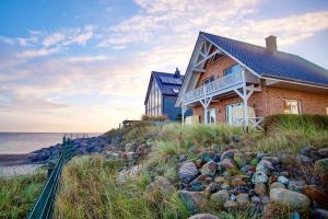 a house on the side of a beach at Ferienhaus Auf der Ostsee in Kappeln