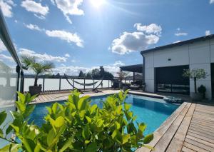 a view of a swimming pool on a building at La Velaysienne 5 étoiles piscine,sauna, jacuzzi in Le Monteil
