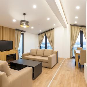 a living room with a couch and a table at SUNNYHOME Chalet, Neunburg vorm Wald in Neunburg vorm Wald