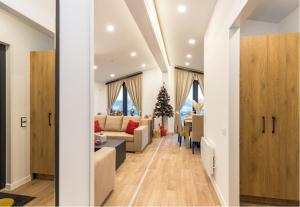 a living room with a christmas tree in the distance at SUNNYHOME Chalet, Neunburg vorm Wald in Neunburg vorm Wald