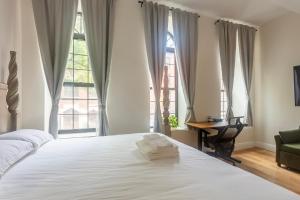 Ένα ή περισσότερα κρεβάτια σε δωμάτιο στο Little manhattan near Time Square +87 φωτογραφίες