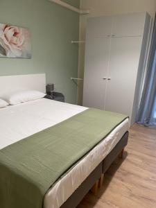 Łóżko lub łóżka w pokoju w obiekcie Il Mughetto