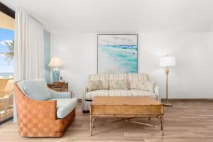 a living room with a couch and a coffee table at Costa Del Sol Resort in Fort Lauderdale