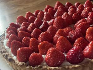 a cake with strawberries on top of it at Lismacue House in Bansha +37 photos