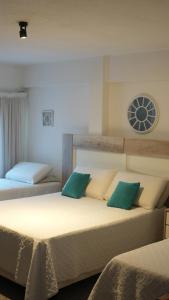 Postel nebo postele na pokoji v ubytování Hotel Plaza Formosa