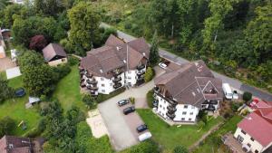 an overhead view of a large house with a garage at Residenz Sachsensteinblick in Bad Sachsa