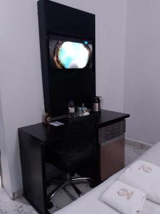 TV a/nebo společenská místnost v ubytování G-pinnacle Hotel