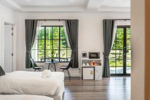 Ένα ή περισσότερα κρεβάτια σε δωμάτιο στο Tarn Villa Krabi +74 φωτογραφίες