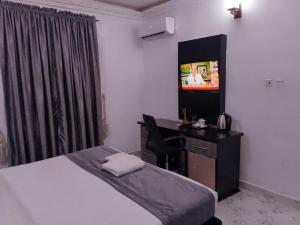 TV a/nebo společenská místnost v ubytování G-pinnacle Hotel