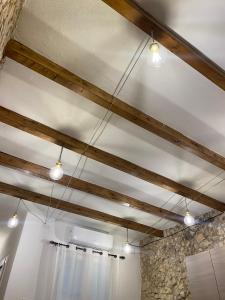 a row of lights hanging from a ceiling at Dani's House Holiday in Cagliari