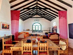 a dining room with a wooden table and chairs at Rural Mountain Oasis with Pool in Almogia, Malaga in Almogía