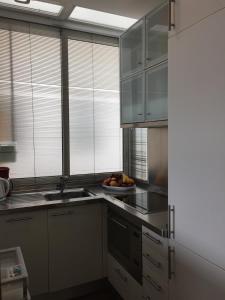 Kuchyňa alebo kuchynka v ubytovaní Boulevard Apartmento + 8 fotografií