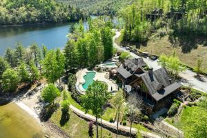 an aerial view of a house with a lake at Lake and Pool Access at Bear Lake Reserve Condo! in Tuckasegee