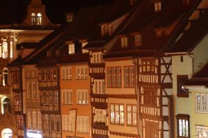 a group of houses in a city at night at Mr.& Mrs. President in Erfurt