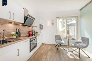 Η κουζίνα ή μικρή κουζίνα στο Ferienhaus Kuschelnest +17 φωτογραφίες