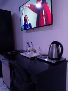 TV a/nebo společenská místnost v ubytování G-pinnacle Hotel