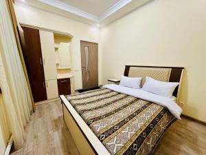a bedroom with a large bed in a room at Hotel Dilijan Old Center in Dilijan
