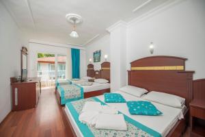 Postel nebo postele na pokoji v ubytování Sunberk Hotel