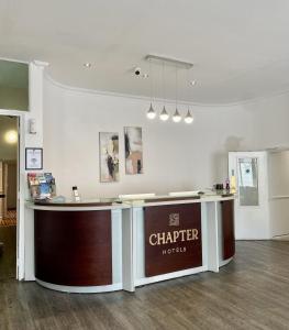 a check in counter in a store at The Chapter Hotels - Leisure Inn in London