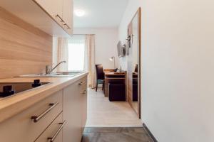 Kuchyň nebo kuchyňský kout v ubytování Aparthotel Othello