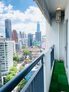 a balcony with a view of a city at Seri bukit ceylon residency by An homes in Kuala Lumpur