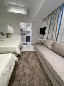 Μια τηλεόραση ή/και κέντρο ψυχαγωγίας στο Comfy Tourist Corner - Heliopolis - Hotel Apartments