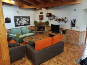 a living room with two couches and a fireplace at Maittia-Larraona in Larraona