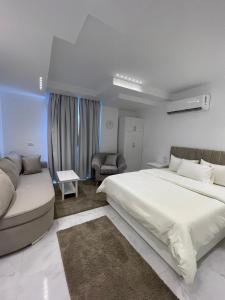 Ένα ή περισσότερα κρεβάτια σε δωμάτιο στο Comfy Tourist Corner - Heliopolis - Hotel Apartments