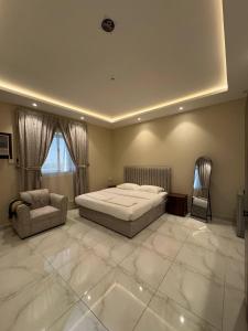 Postel nebo postele na pokoji v ubytování ركن صحاري للشقق المخدومة 3 المروج Rukn Sahari for Served Apartments