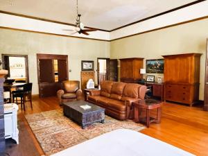 a living room with a couch and a table at Above the Shot Harrisons Gem in Harrison