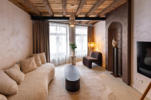 a living room with a couch and a table at Boutique Hotel Venlo in Venlo