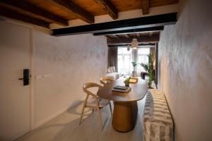 a room with a table and chairs in a room at Boutique Hotel Venlo in Venlo