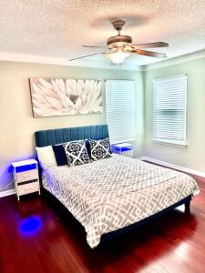 a bedroom with a bed and a ceiling fan at Modern comfort 2BR-2BA Retreat in Concord