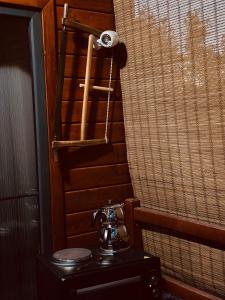 a telephone on a table next to a window at Villa E&E Dragancë in Gjilan