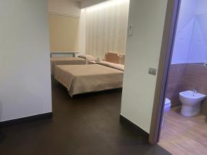 Postel nebo postele na pokoji v ubytování Hotel Ristorante Borgo Antico