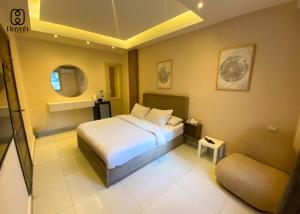 a hotel room with a bed and a couch at Hayah Waterfalls Hotels in Alexandria