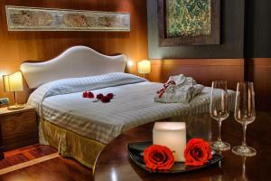 A bed or beds in a room at BV Grand Hotel Assisi