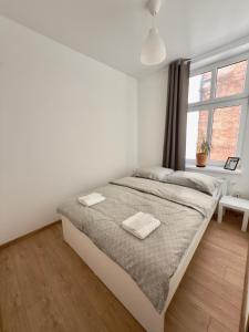 Ένα ή περισσότερα κρεβάτια σε δωμάτιο στο Apartament Stare Centrum