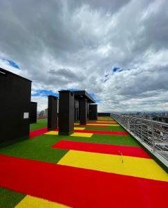 a view of a building with red yellow and green floors at Estilo y confort Bogotá centro in Bogotá +14 photos