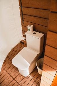 a toilet with a roll of toilet paper on it at Campera Valle de Guadalupe in Ensenada +105 photos