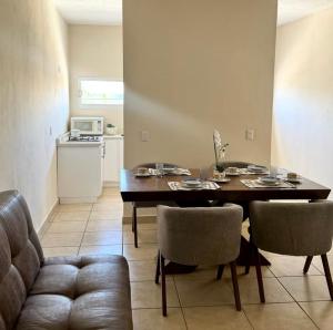 a living room with a dining room table and chairs at JUCAR Place in Villa Hidalgo