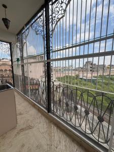 a room with a large window with a view at Divine Sanctuary at Radha Raman in Vrindāvan