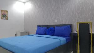 A bed or beds in a room at Prominent Hotel and Suites
