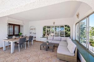 a living room with a couch and a table at Casa May in La Cala de Mijas