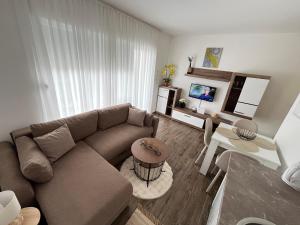a living room with a couch and a table at Mića Apartment in Veliko Gradište