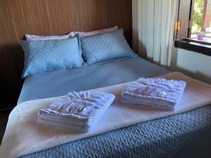 Ένα ή περισσότερα κρεβάτια σε δωμάτιο στο Guesthouse da Alê