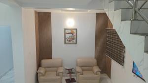 A seating area at Prominent Hotel and Suites