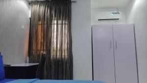 A bed or beds in a room at Prominent Hotel and Suites